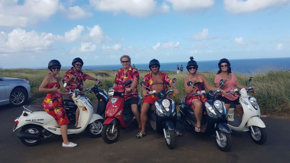 7954cc_9bb63a1068734d41b3c1e1bdf087bf89_mv2 a group of people on 808 mopeds