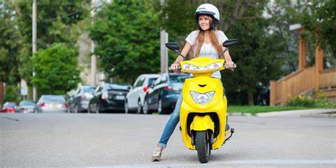 a person riding a motorcycle on a city street